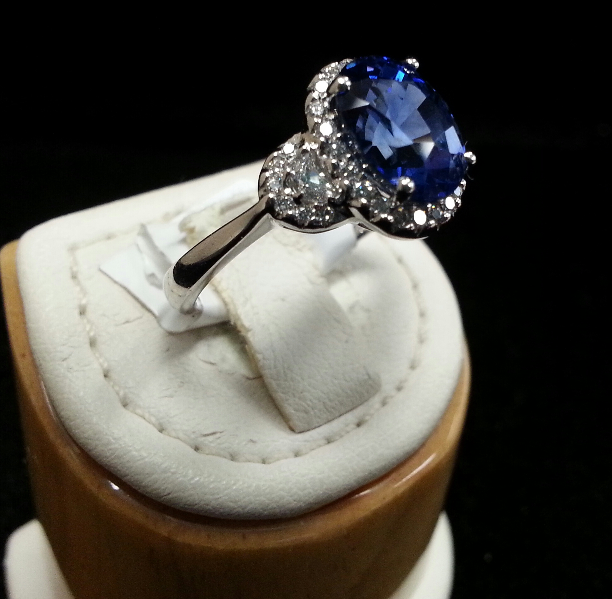 Oval Blue Sapphire and Half Moon Diamond Ring with Micro Pave Set in 18k White Gold. Sapphire is 3.67ct and Diamonds are 0.39ctw